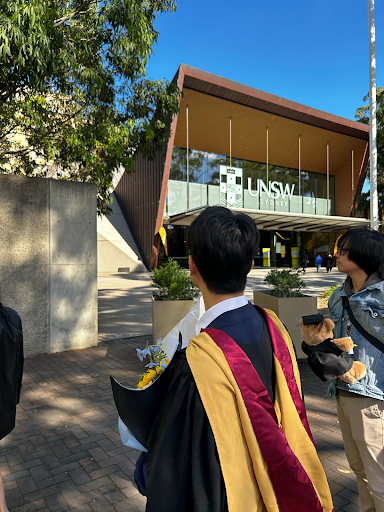 Jing looking at UNSW building during graduation ceremoney day